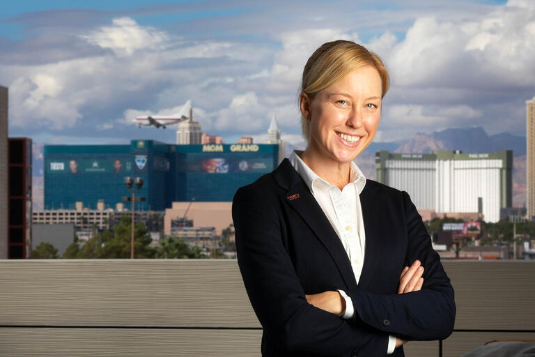 Katheryn &quot;K.C.&quot; Brekken, Assistant Research Professor for the School of Public Policy and Leadership and MGM Resorts International Institute at UNLV poses in front of the Las Vegas Strip.