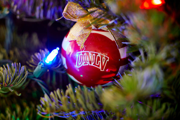 Red &quot;UNLV&quot; Christmas ornament on tree